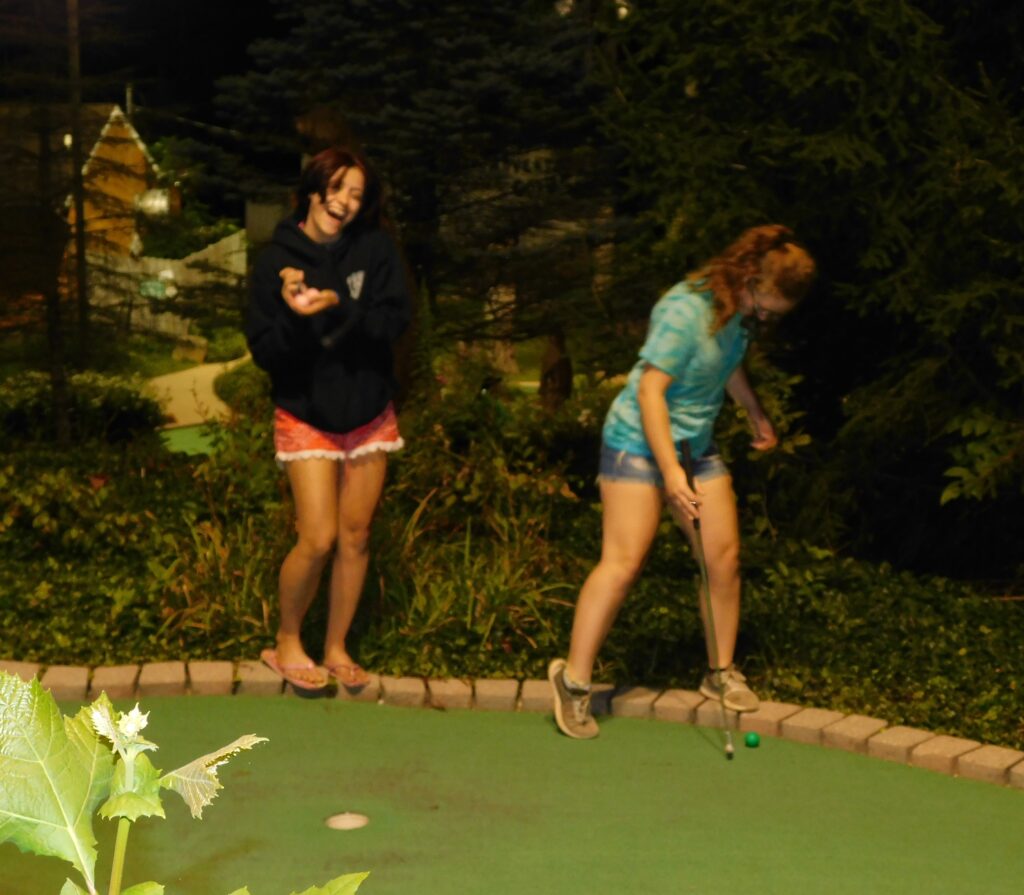 Two girls having fun at Late Night Golf.